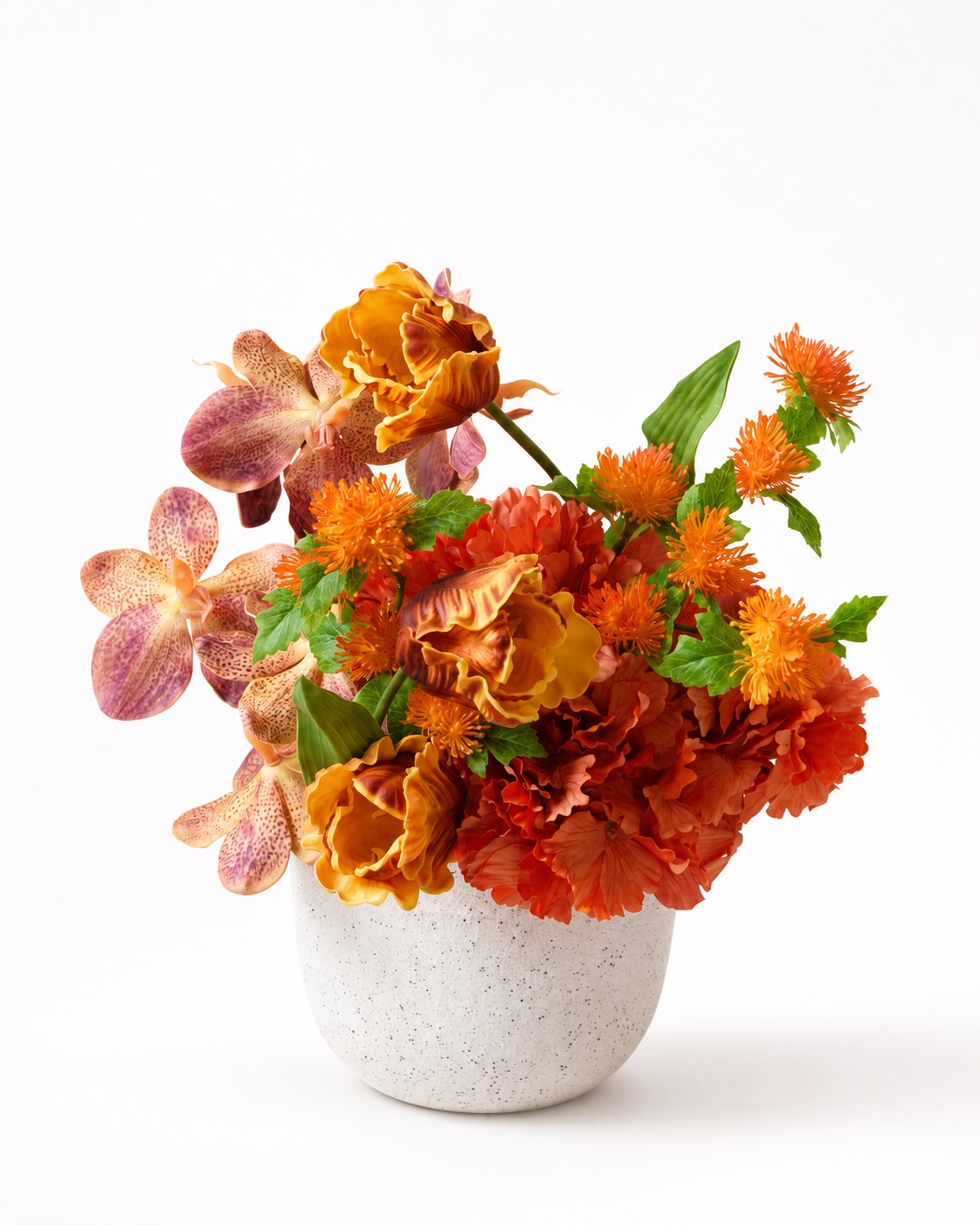Orange artificial floral arrangement in a white bowl