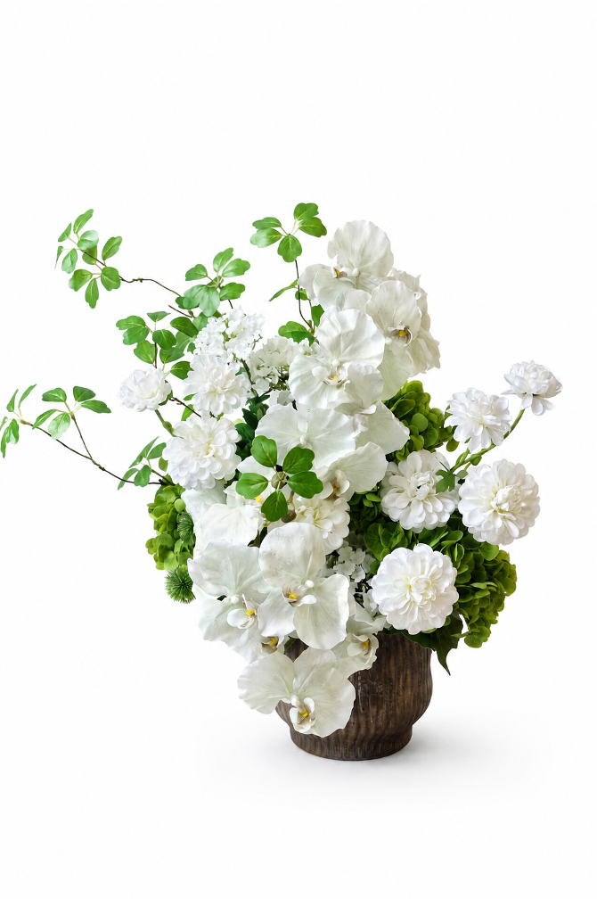 Tall white artificial orchid and floral arrangement in a wood vase