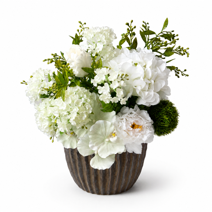 White artificial flower arrangement in a textured wood vase