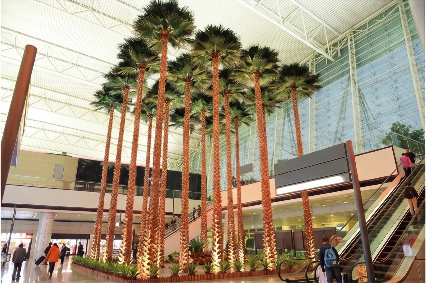 Large artificial palm trees installed in a shopping mall